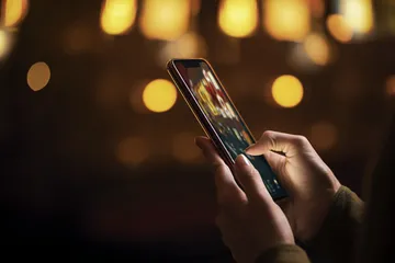 BDOK Casino Games — Enjoy nonstop entertainment A close-up shot of golden coins falling around a spinning roulette wheel, representing immersive casino action at BDOK.