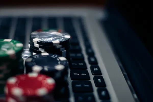 BDOK Jackpot Slots — Spin for massive rewards A dramatic shot of winning sevens landing on a slot reel surrounded by shining gold coins, symbolizing big wins.